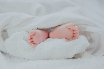Body of a Deceased Newborn Found Buried in a Shallow Grave.
