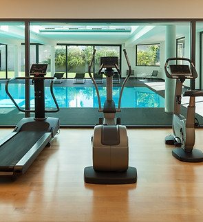 Treadmill and elliptical machine side by side in a gym setting. Cardio fitness equipment for effective workouts. Stay active and achieve your fitness goals with these machines