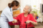Female nurse with senior woman patient