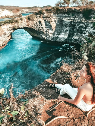 woman photographing landscape clif