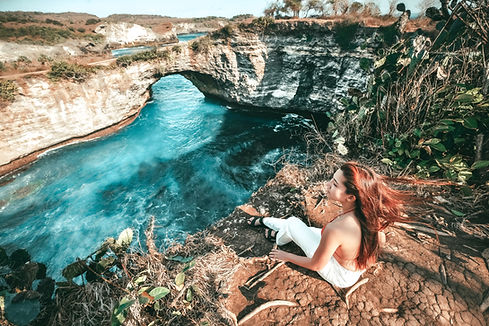 woman photographing landscape clif