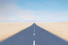 Straight road disappearing into horizon under blue sky – symbolising strategic clarity and future planning