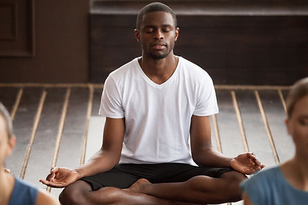 Man Meditating Indoors