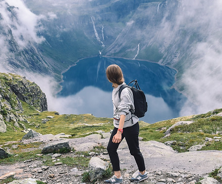 Hiker Overlooking Mountain Lake