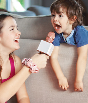 Child talking into a microphone