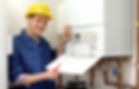 Plumber servicing a boiler