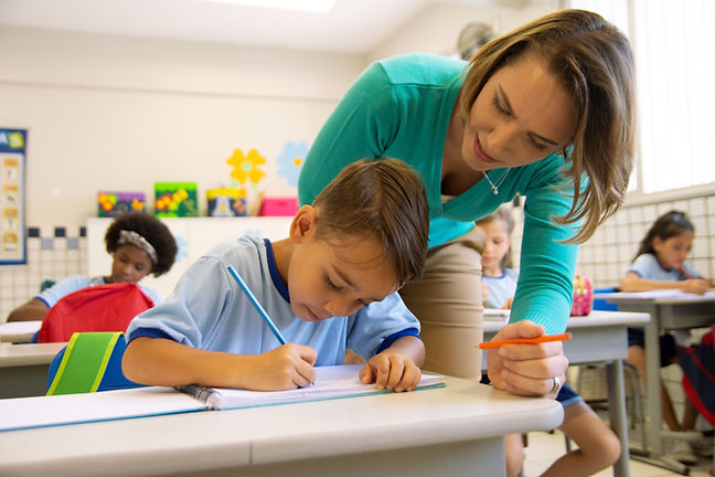 Teacher Assisting Student