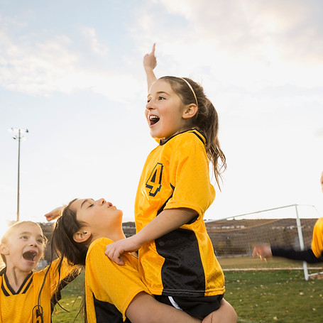 Girls soccer team celebrating success