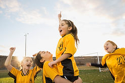 Girls soccer team celebrating success