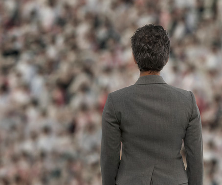 Businesswoman in Front of Crowd