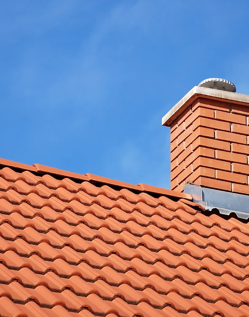 Chimney on a freshly tiled roof