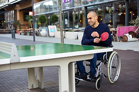Image of a man playing Table Tennis in a Wheelchair