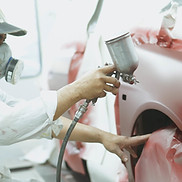 Mechanic Working on Car