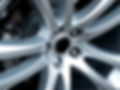 A close-up photo of a sports car's alloy wheel