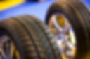 Two new car tyres on rims