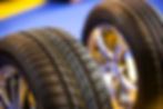Two new car tyres on rims