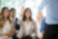 A multi-ethnic group of corporate business professionals are getting trained by the company