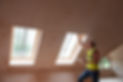 a person inspecting loft roof