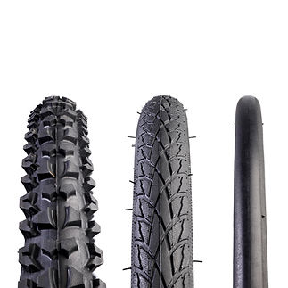 Bicycle tyres, close up. From left to right are a: mountain bike tyre, hybrid tyre