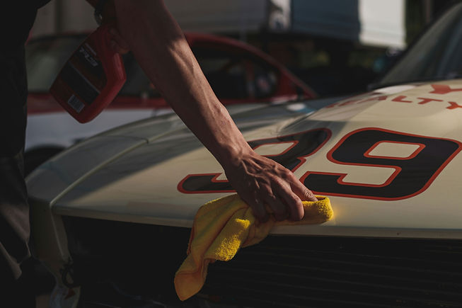 Hand polishing race car