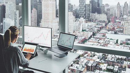 A woman at the office overlooking the ci