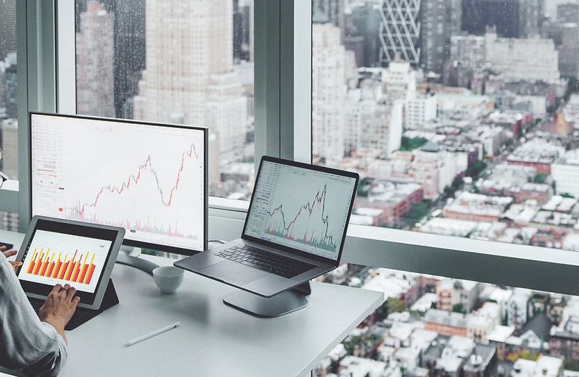 A woman at the office overlooking the city skyline