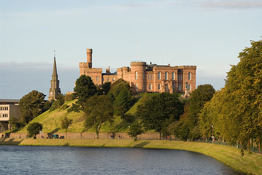Historic stone church tower and grounds in Northumbria countryside UK