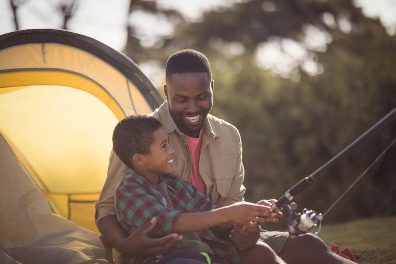 A father finally enjoying time with his child after creating a parenting plan that provided him with access to his son.