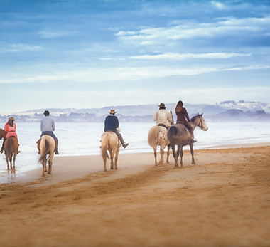 Cavaliers sur la plage