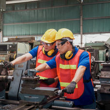 Two Technicians Working On Machine