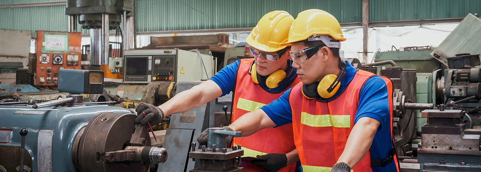 Two Technicians Working On Machine