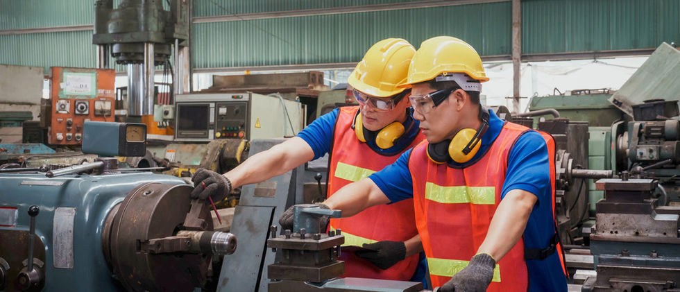 Two Technicians Working On Machine