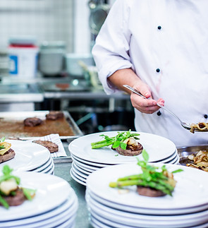 The chef arranges the dishes