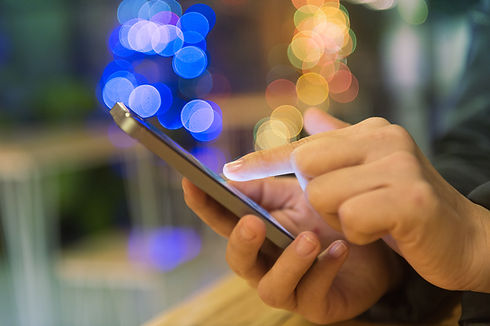 a person's hand with smartphone