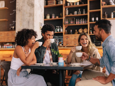 Group of friends sitting together in a cafe