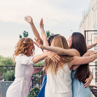 young women hugging at a party