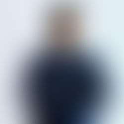 confident professional man with arms crossed representing outward success and composure