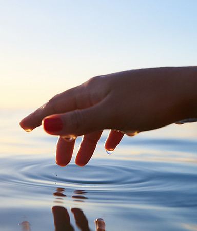 Hand Touching Water