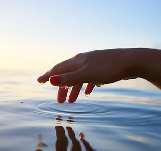 Hand Touching Water
