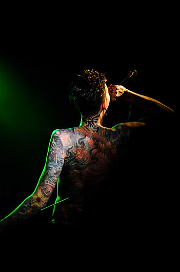 Tattooed Performer Singing