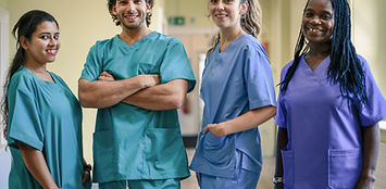 A group of diverse, smiling care providers.
