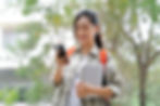 Vietnamese college student using smartphone