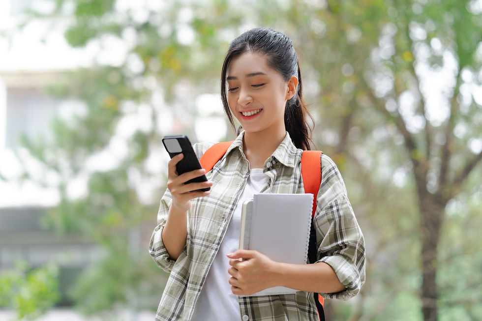 Vietnamese college student using smartphone