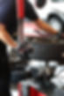 Mobile mechanic working on tyre repair