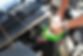 Cropped Hands Of Mechanic Checking Car Battery