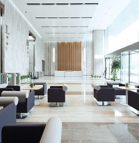 Light-filled, open lobby space with modern seating and sparkling clean floors.