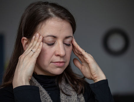 Woman holding temples
