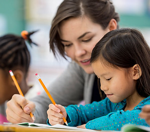 Woman Tutoring Child