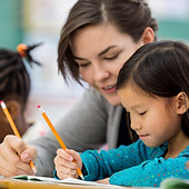 Woman Tutoring Child