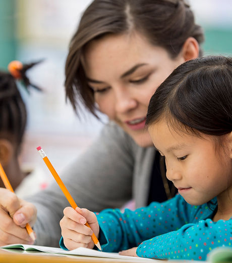 Woman Tutoring Child